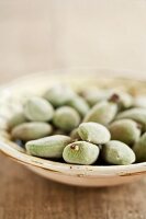 Fresh almonds in a ceramic bowl