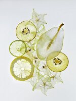 Various sliced fruits (pear, kiwi, lemon, star fruit)