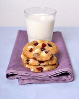 Macadamia nut and cranberry cookies and a glass of milk