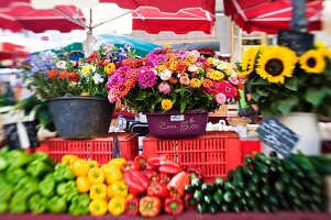 Flowers and vegetables on a market stall