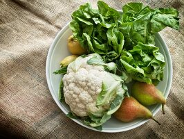 Cauliflower, pears and salad in a bowl