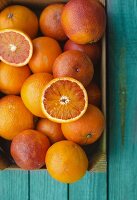 Blood oranges in a wooden crate
