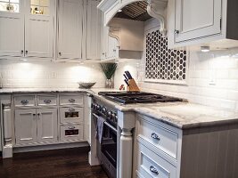 Kitchen with Marble Counter Tops and an Oven