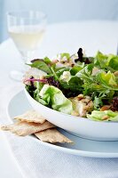 Grilled Chicken Salad with Mixed Greens, Caesar Dressing, Glass of White Wine and Crackers