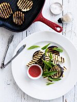 Grilled eggplant slices with halloumi