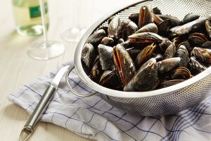 Cooked mussels in a colander