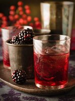 Blackberry liqueur with ice cubes