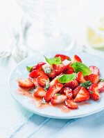 Strawberry salad with basil and lemon juice