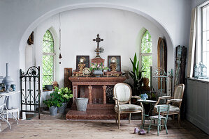 Rustic living room with vaulted ceiling, cross and vintage furniture