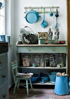 Vintage kitchen cupboard with crockery and decorative objects