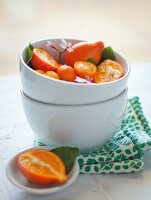 Tangelos and Oranges in a White Bowl