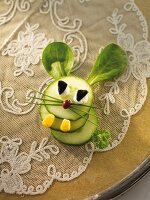 A cucumber hare with lamb's lettuce ears