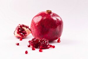 Whole pomegranate and pieces of pomegranate