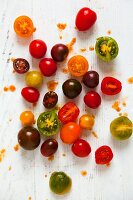 Various tomatoes on wooden board