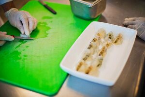 Prawns being cut into a butterfly shape