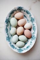 A plate of different coloured eggs
