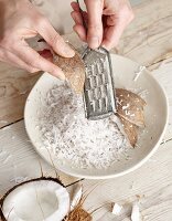 Coconut being grated