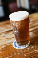 A glass of ale in a pub
