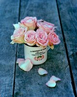 Posy of roses in romantic metal mug