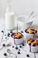 Three clafoutis with blueberries and cherries