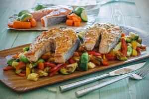 Roasted salmon on a bed of mixed vegetables