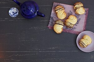 Piped biscuits with fine chocolate stripes
