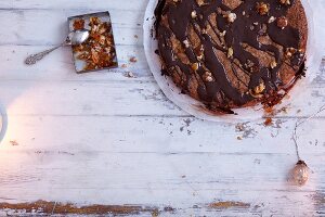 Honey cake with chopped nuts and chocolate glaze