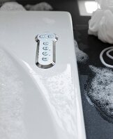 Detail of a bubble jet Bath, buttons on a stainless steel cover plates for various settings