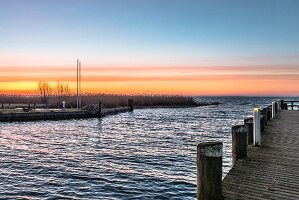 Sunset over the harbour in Ahrenshoop on the Baltic Sea