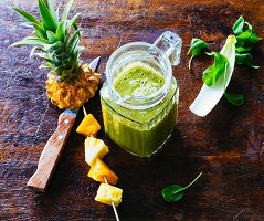 Mango and pineapple smoothie with passion fruit, batavia lettuce, spinach and chicory