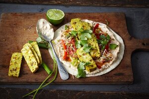 Vegan wheat wraps with curry and mango tofu, bean sprouts and peanut cream