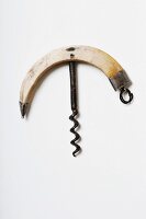 A hog tooth-handle corn screw with a handcrafted spiral and silver adornments, 19th century (Von Kunow Collection)