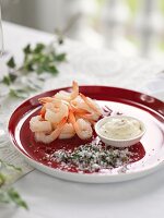 A prawn with a dip and herb salt