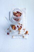 A jar of mixed nuts and berries