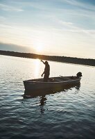 Freshwater fishermen Wolfgang Richter catching eels at Lake Neuendorf (Spreewald, Germany)