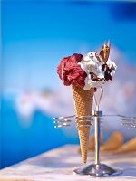 Two types of ice cream in cones in a cone holder