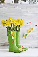 Wellington boots repurposed as spring vase & decorated with paper butterflies