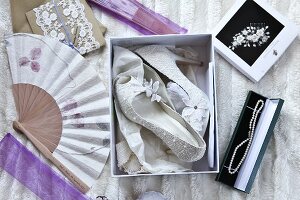 White high heels with lace effect and other bridal accessories