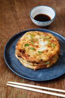 Cong You Bing (fried spring onion fritters with a soya dip, China)