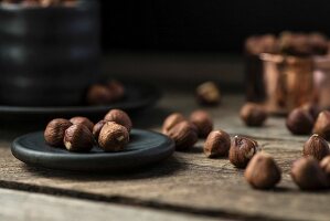 Hazelnuts on a plate and in a cup