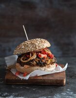 Vegan bean and sweet potato burger with a tomato and lime salsa