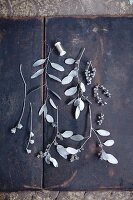 Twigs and leaves sprayed with silver paint