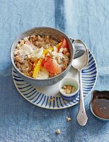 Millet muesli with fresh citrus fruits and bananas