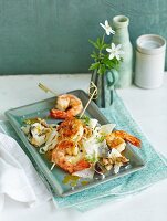 Waldorf salad with fennel and prawn skewers