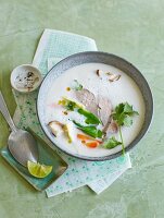 Thai coconut soup with duck breast, galangal and vegetables