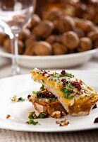 Slices of bread topped with mushrooms, nuts and cheese