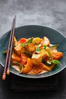 Colourful vegetable curry with fried tofu