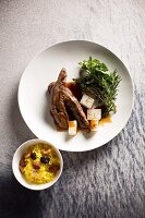 Lamb fillets on a clove and carob sauce with saffron rice and kohlrabi (Syria)