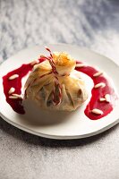 Rice and lamb in a pastry parcel with pomegranate sauce (Syria)