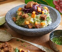 Dhal with red lentils, rice, caramelised onions, sweet potatoes and crispy croutons (Burma)